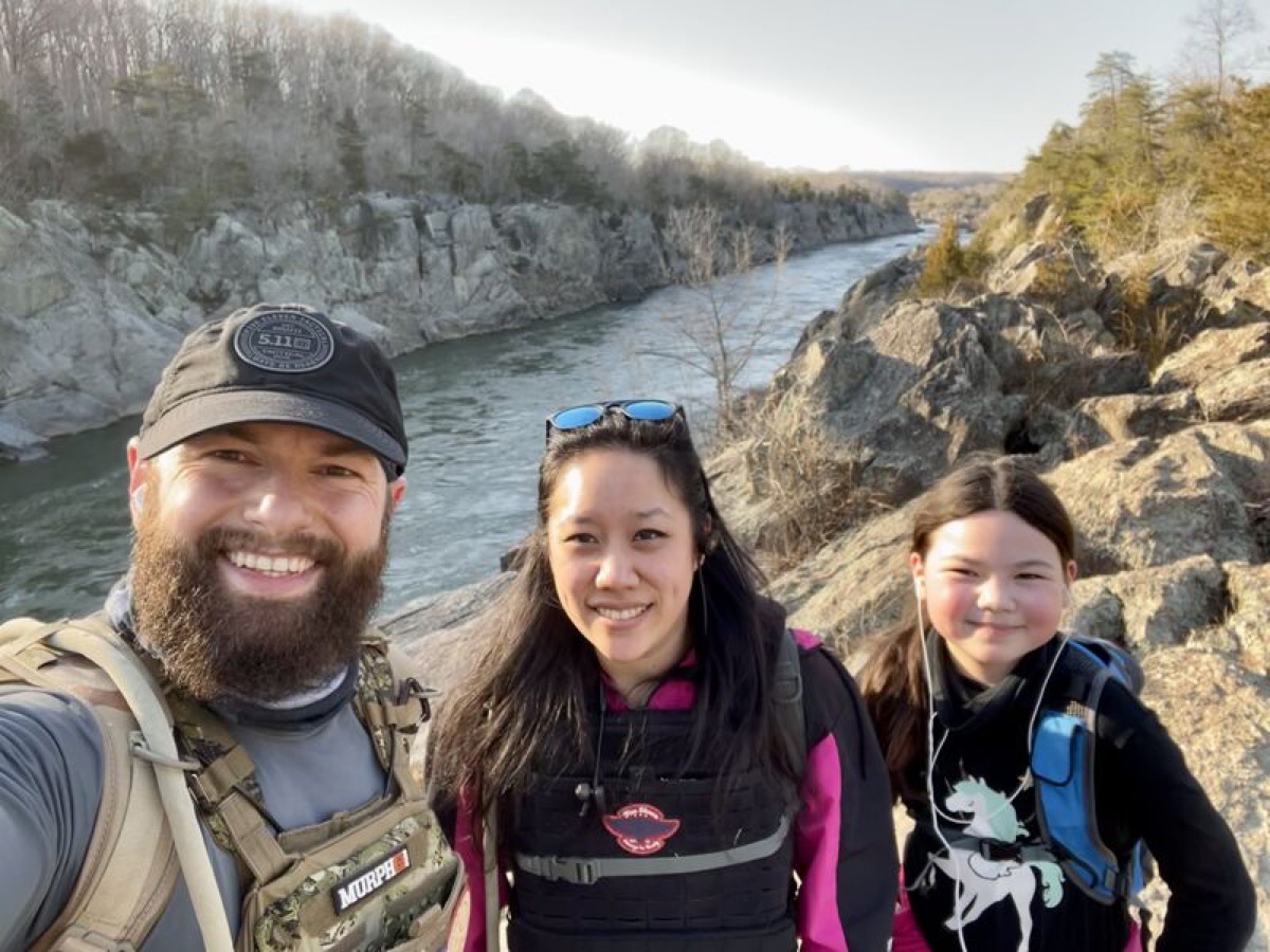 Vadim Snitkovsky hiking with his family above a river gorge
